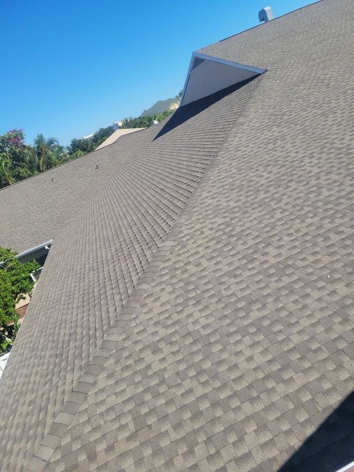 A roof with a brown shingled roof done by Marathon Roofing & Contracting in Port Orange, FL